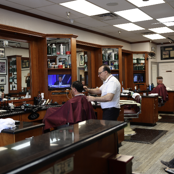 Inside Classic Barbershop — warm walnut interior